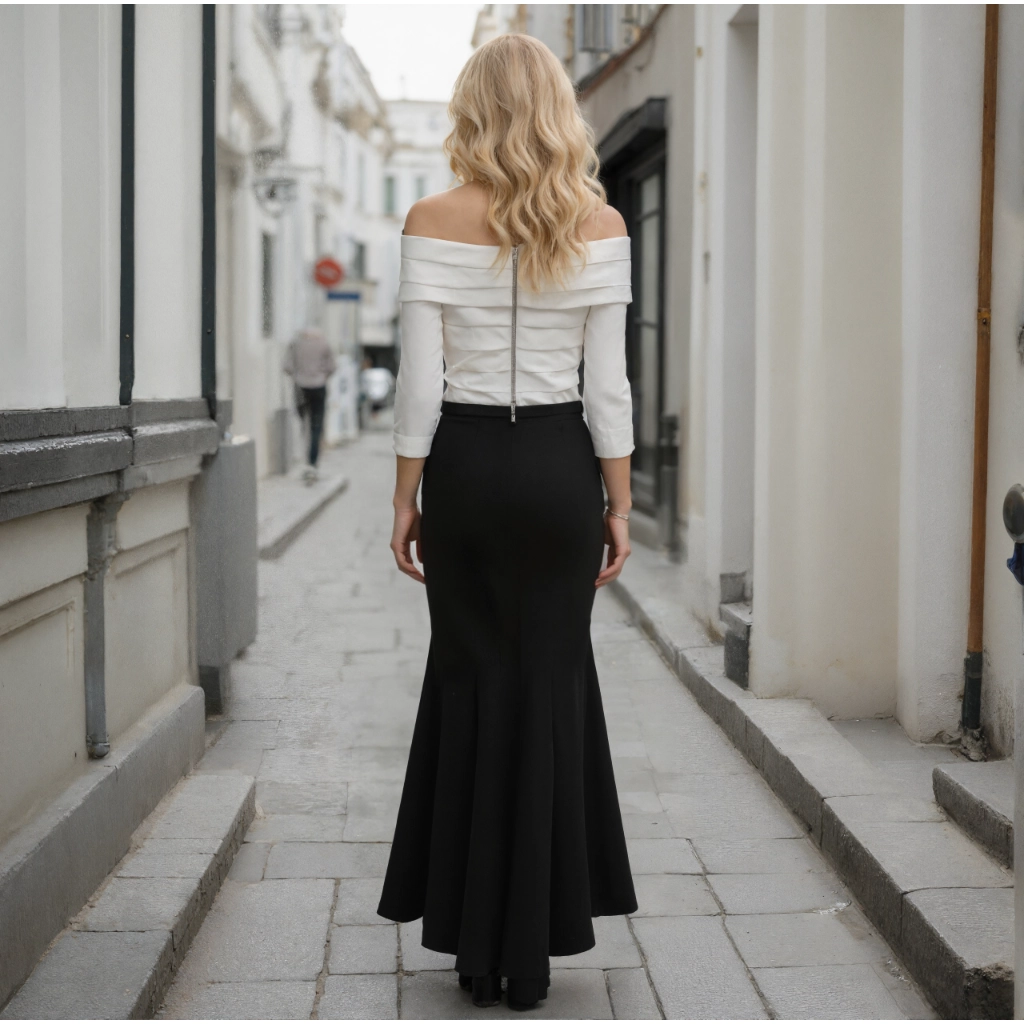 Second image of Black and white color-blocked off-the-shoulder twisted fishtail gown