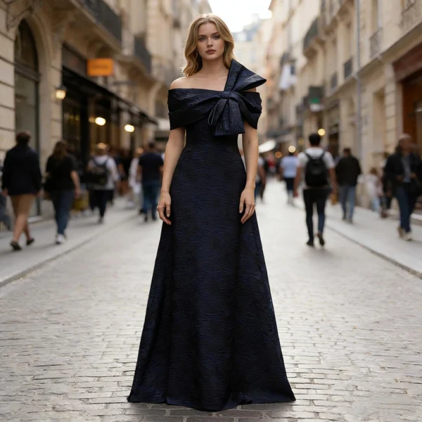 Navy blue one-shoulder gown with large bow and full skirt